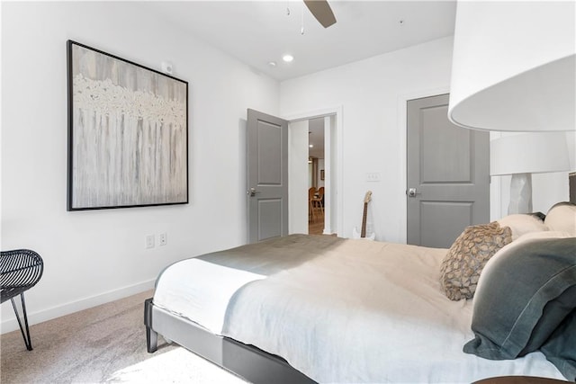 bedroom with light carpet and ceiling fan