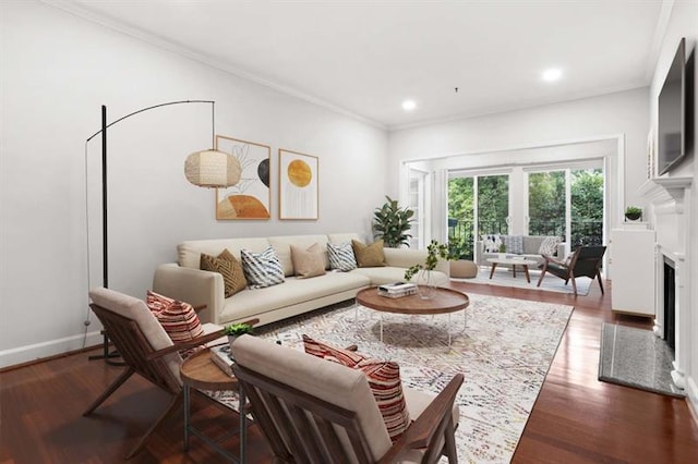 living room with dark hardwood / wood-style flooring and ornamental molding