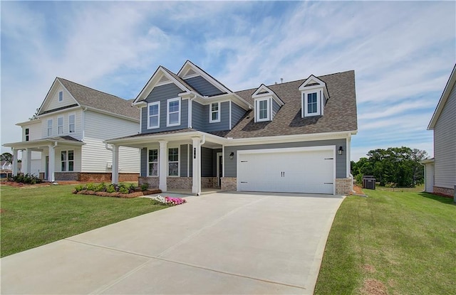 view of front of property with a garage, brick siding, a front lawn, and central AC unit