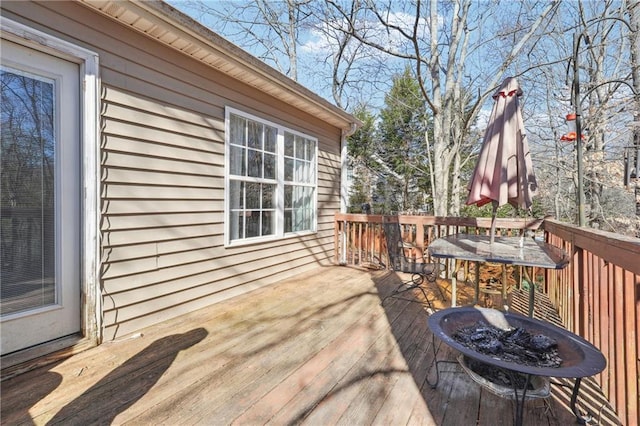 deck with outdoor dining area