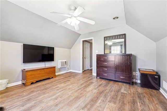 additional living space with vaulted ceiling, ceiling fan, and wood finished floors