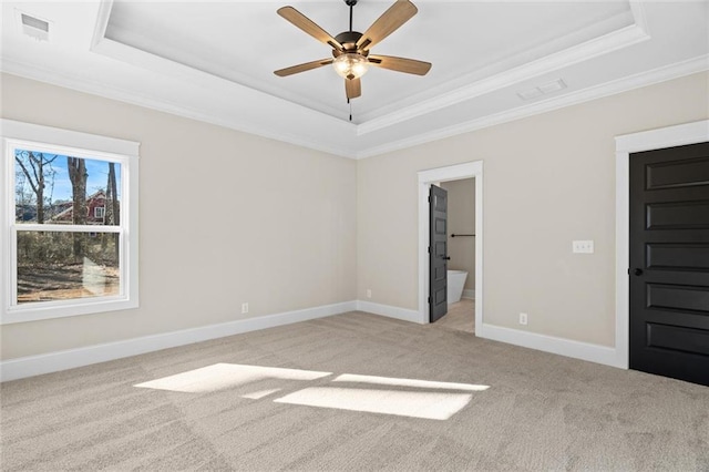 473 Nugget Rd, Carrollton, GA 30117 - unfurnished bedroom featuring light carpet, a tray ceiling, and baseboards