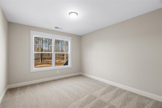 473 Nugget Rd, Carrollton, GA 30117 - spare room with carpet floors, baseboards, and visible vents