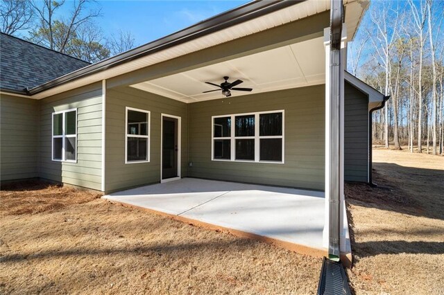 473 Nugget Rd, Carrollton, GA 30117 - entrance to property featuring ceiling fan, roof with shingles, and a patio area
