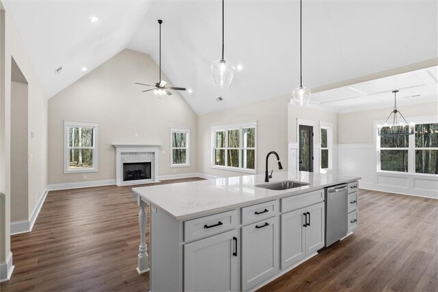 473 Nugget Rd, Carrollton, GA 30117 - kitchen with dishwasher, open floor plan, hanging light fixtures, a kitchen island with sink, and a sink
