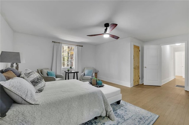 bedroom with hardwood / wood-style floors and ceiling fan