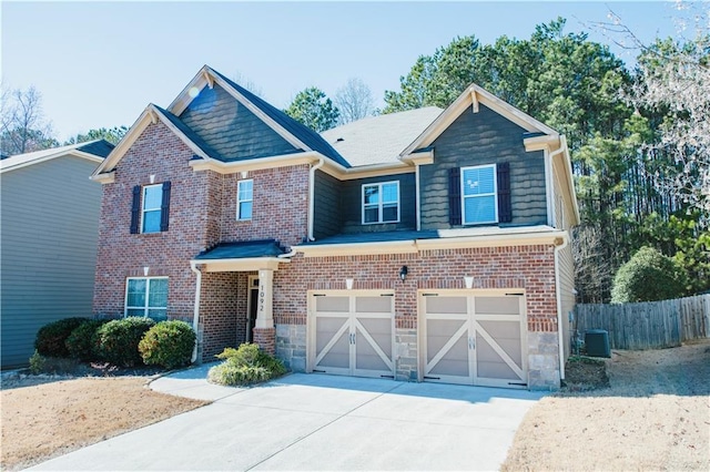 craftsman house with central AC, fence, brick siding, and driveway