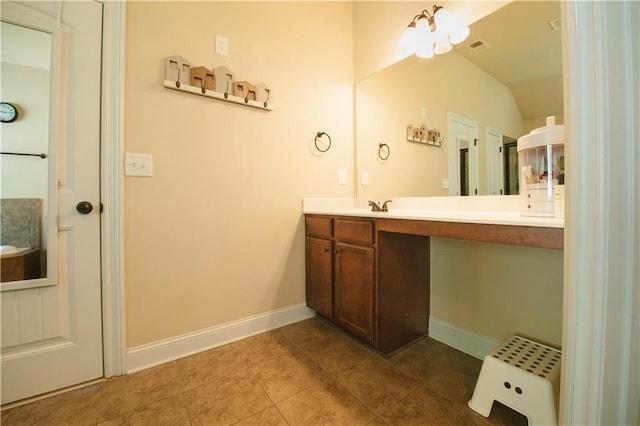 bathroom with vanity, tile patterned floors, visible vents, and baseboards