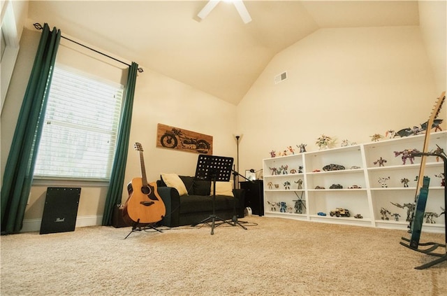 sitting room featuring visible vents, ceiling fan, carpet, and lofted ceiling