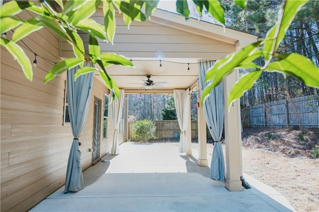 view of patio featuring a fenced backyard and a ceiling fan