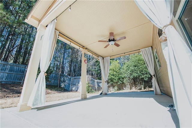 view of patio / terrace featuring a fenced backyard and a ceiling fan