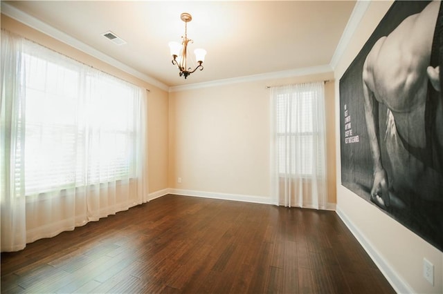 unfurnished room featuring a chandelier, visible vents, dark wood-style floors, and ornamental molding