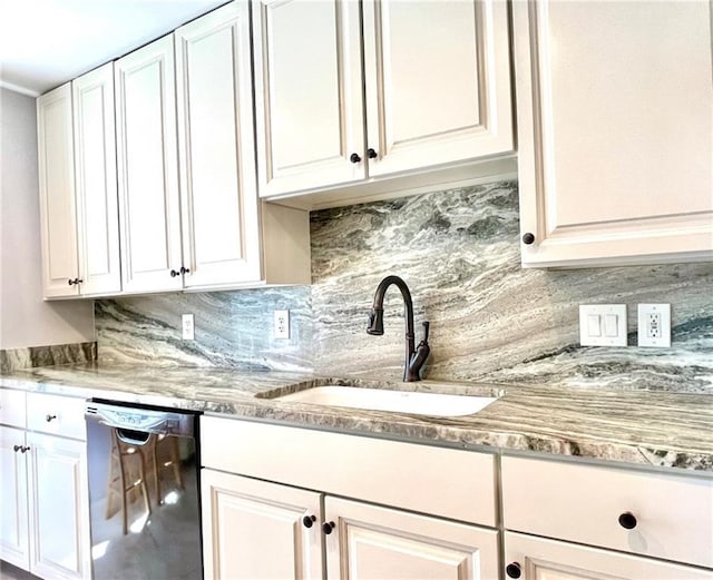 kitchen featuring a sink, decorative backsplash, white cabinetry, and dishwasher