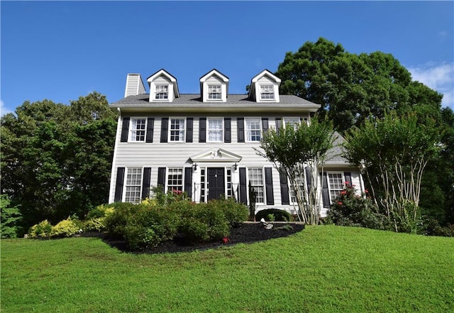 5040 Puritan Dr, Sugar Hill, GA 30518 - view of front of house with a front lawn and a chimney