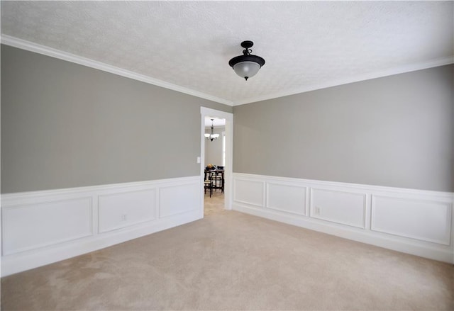 5040 Puritan Dr, Sugar Hill, GA 30518 - unfurnished room featuring a wainscoted wall, light carpet, a chandelier, and ornamental molding
