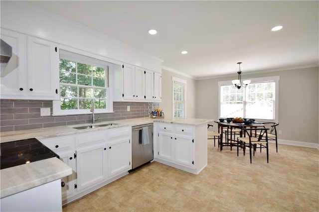 5040 Puritan Dr, Sugar Hill, GA 30518 - kitchen with stainless steel dishwasher, a peninsula, healthy amount of natural light, white cabinetry, and ornamental molding