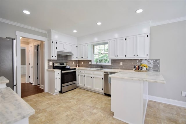 5040 Puritan Dr, Sugar Hill, GA 30518 - kitchen with appliances with stainless steel finishes, under cabinet range hood, a peninsula, white cabinets, and decorative backsplash