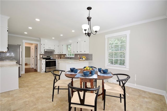 5040 Puritan Dr, Sugar Hill, GA 30518 - dining area with healthy amount of natural light, ornamental molding, recessed lighting, and a chandelier
