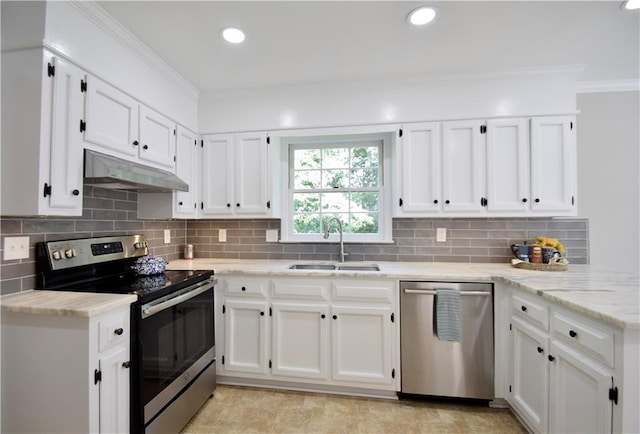 5040 Puritan Dr, Sugar Hill, GA 30518 - kitchen with appliances with stainless steel finishes, under cabinet range hood, white cabinets, ornamental molding, and recessed lighting