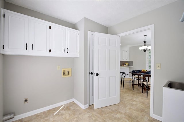 5040 Puritan Dr, Sugar Hill, GA 30518 - laundry area with cabinet space, hookup for a washing machine, hookup for an electric dryer, and a chandelier