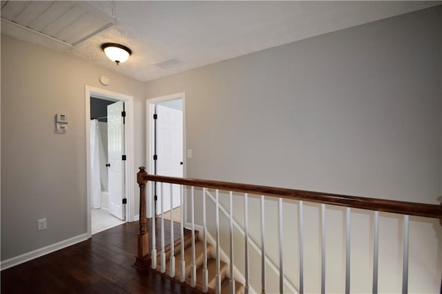 5040 Puritan Dr, Sugar Hill, GA 30518 - hall featuring dark wood finished floors and baseboards