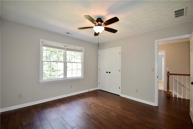5040 Puritan Dr, Sugar Hill, GA 30518 - unfurnished room featuring ceiling fan and dark wood-type flooring