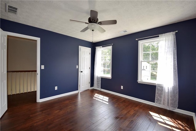 5040 Puritan Dr, Sugar Hill, GA 30518 - unfurnished room with wood finished floors, a ceiling fan, and a textured ceiling