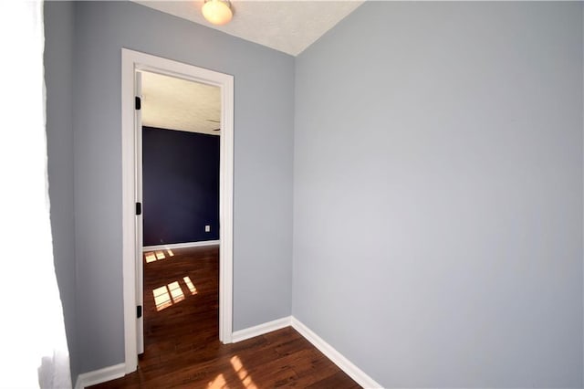 5040 Puritan Dr, Sugar Hill, GA 30518 - empty room with dark wood-style floors and baseboards