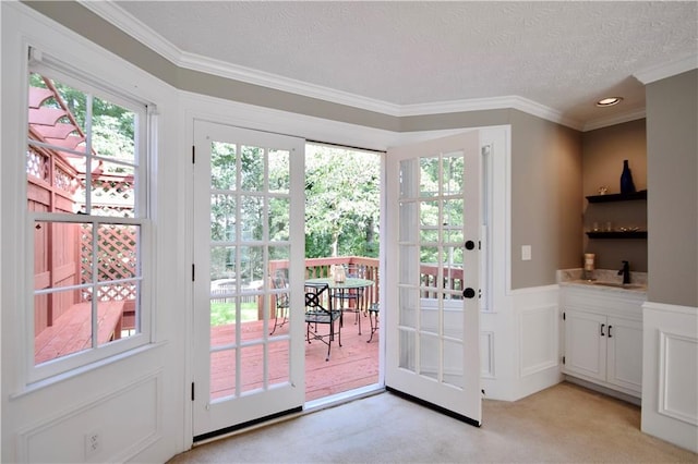 5040 Puritan Dr, Sugar Hill, GA 30518 - entryway featuring ornamental molding, light colored carpet, plenty of natural light, a textured ceiling, and recessed lighting