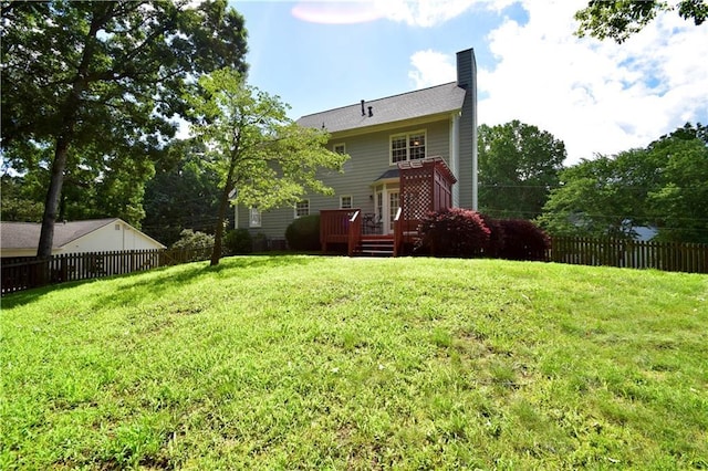 5040 Puritan Dr, Sugar Hill, GA 30518 - back of house featuring a wooden deck and a chimney