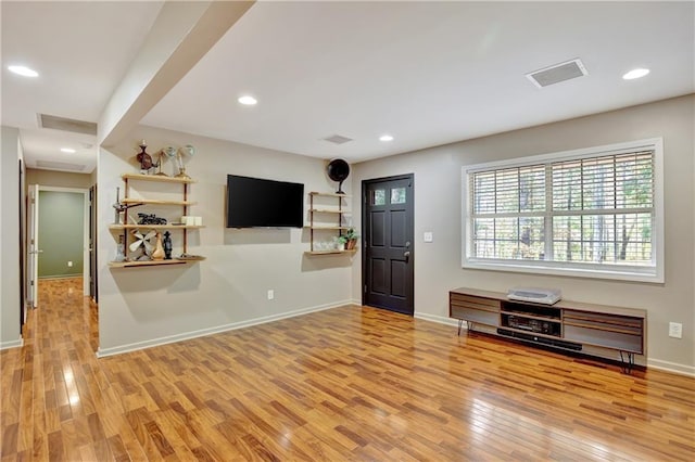 foyer entrance featuring recessed lighting, visible vents, light wood-style flooring, and baseboards