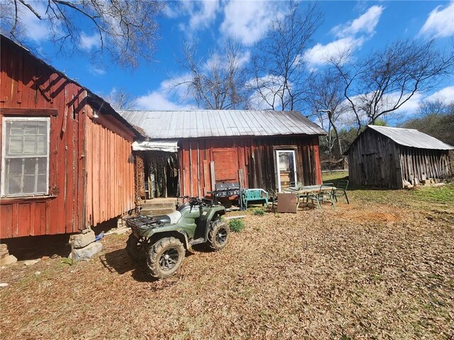 211 Vanns Valley Rd SW, Rome, GA 30161 - exterior space with an outbuilding and metal roof