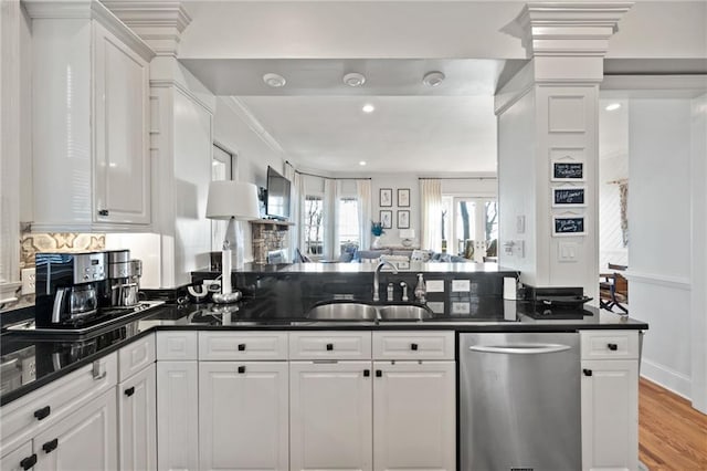 kitchen with white cabinetry, dishwasher, light hardwood / wood-style flooring, and sink