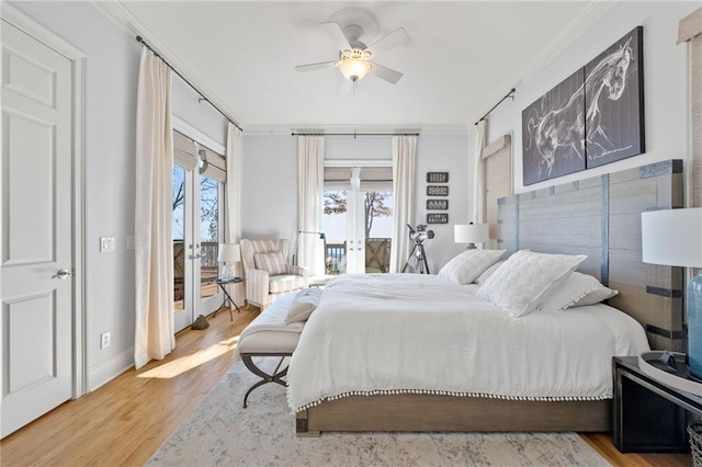 bedroom featuring french doors, crown molding, light hardwood / wood-style flooring, ceiling fan, and access to exterior