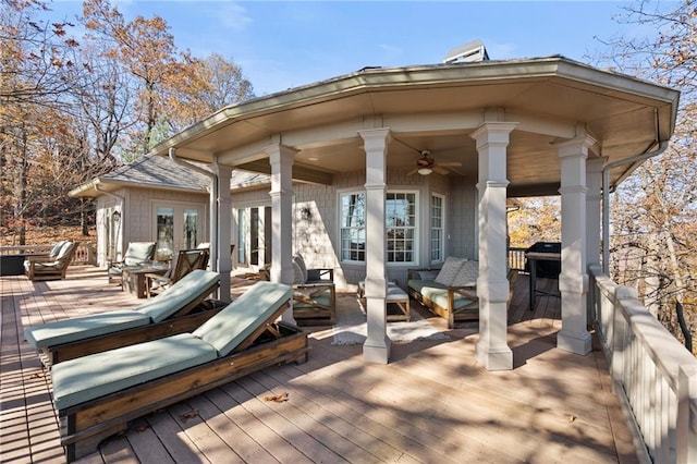 deck featuring french doors and ceiling fan