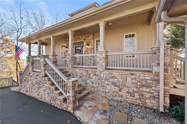 entrance to property featuring covered porch