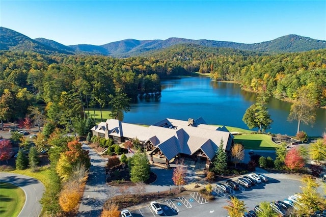 drone / aerial view featuring a water and mountain view