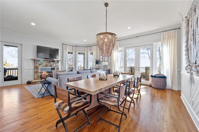 dining area featuring plenty of natural light and light hardwood / wood-style flooring