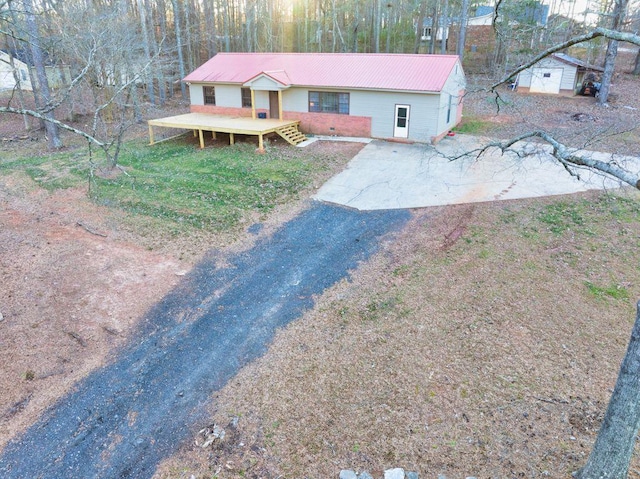 view of front of property with a storage unit