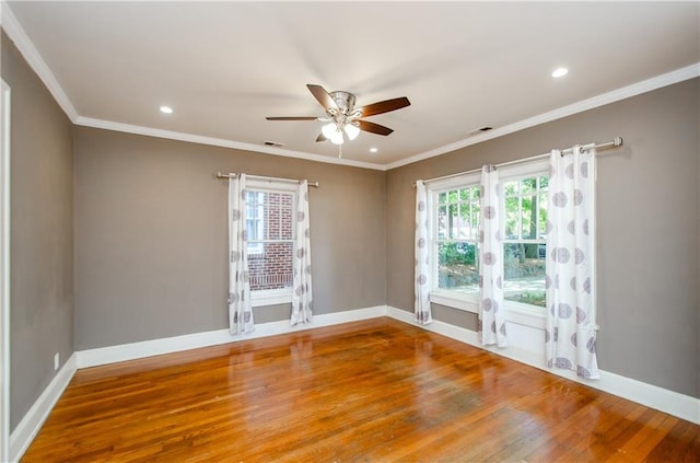 empty room with crown molding, hardwood / wood-style floors, and ceiling fan