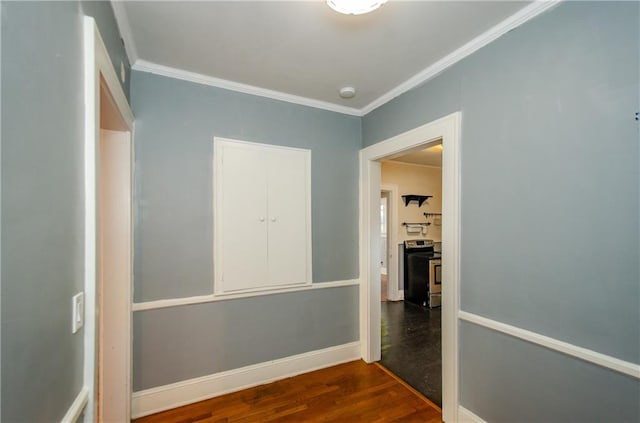 corridor featuring crown molding and dark hardwood / wood-style floors