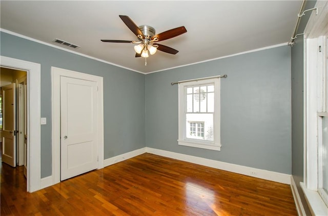 unfurnished bedroom featuring ceiling fan, hardwood / wood-style flooring, and ornamental molding