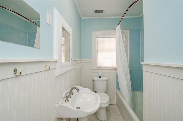 full bathroom featuring toilet, tile patterned flooring, ornamental molding, sink, and shower / bathtub combination with curtain