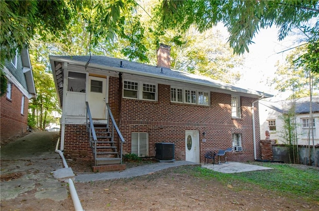 back of property featuring a patio and central AC