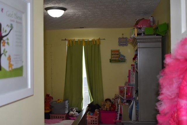 bedroom with a textured ceiling