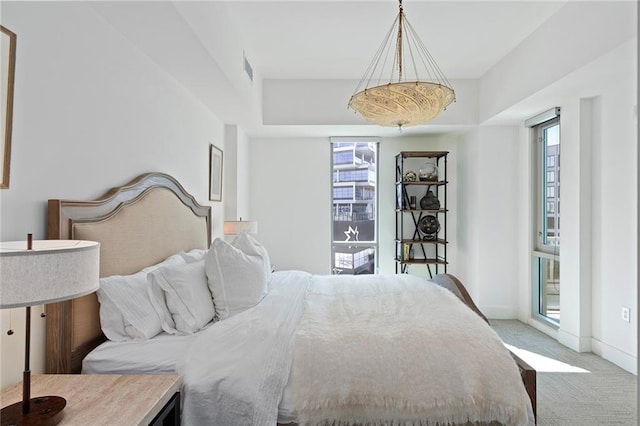 bedroom featuring light carpet