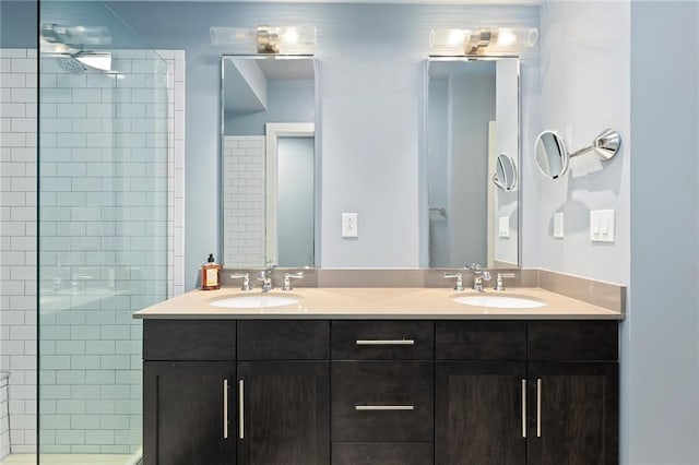 bathroom featuring vanity and a tile shower