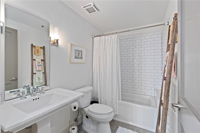 full bathroom featuring toilet, sink, and shower / tub combo