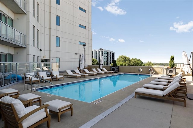 view of swimming pool featuring a patio