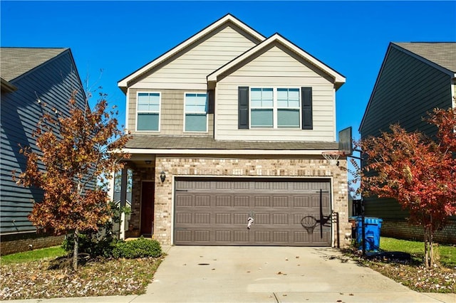 traditional-style home featuring driveway, brick siding, and an attached garage